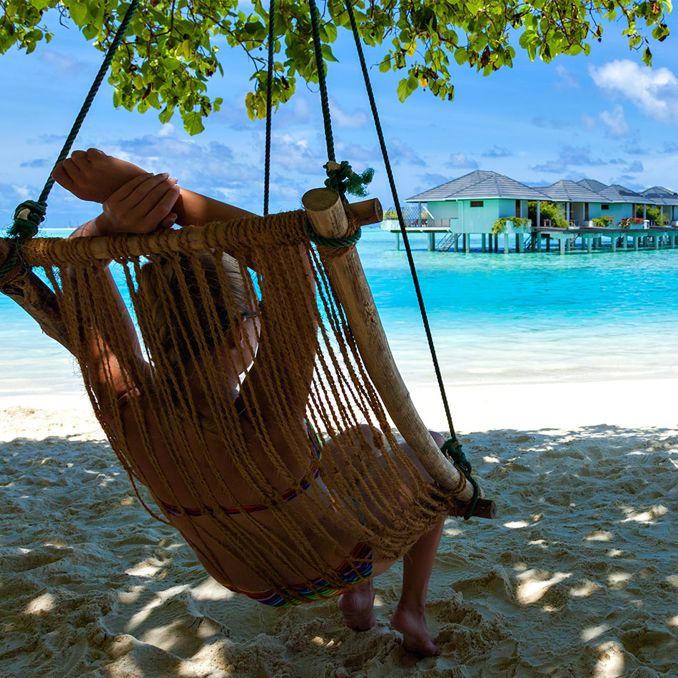 Relaxing in hammock on a Jamaican beach