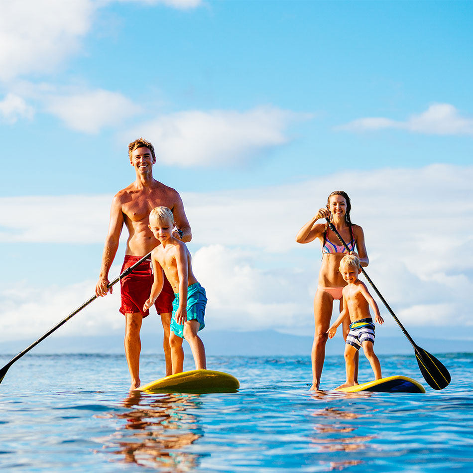 Family paddle boarding in the Caribbean