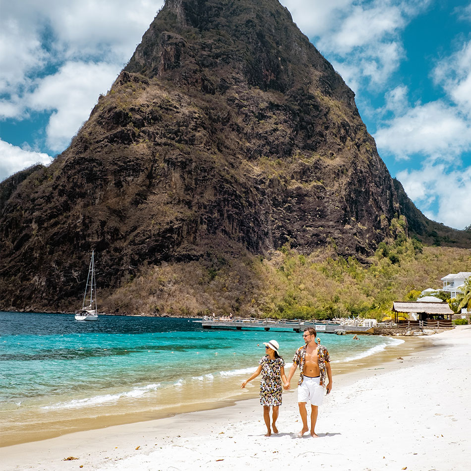 Couple walking on the beach in St. Lucia